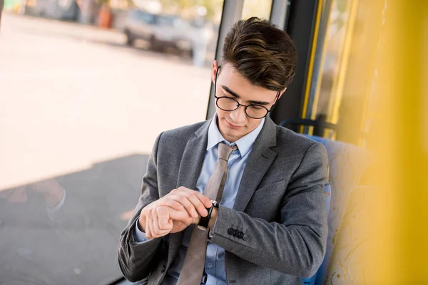 Young businessman in bus — Stock Photo