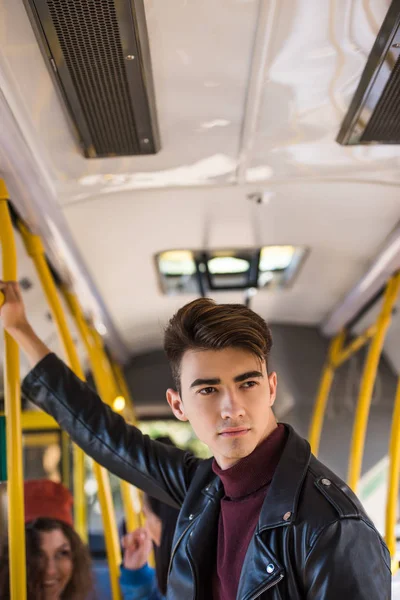 Handsome man in bus — Stock Photo