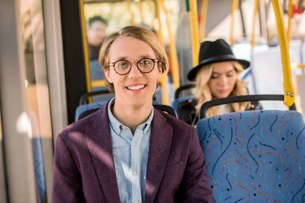 Young man in eyeglasses in bus — Stock Photo