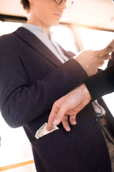 Stealing money in public transport — Stock Photo