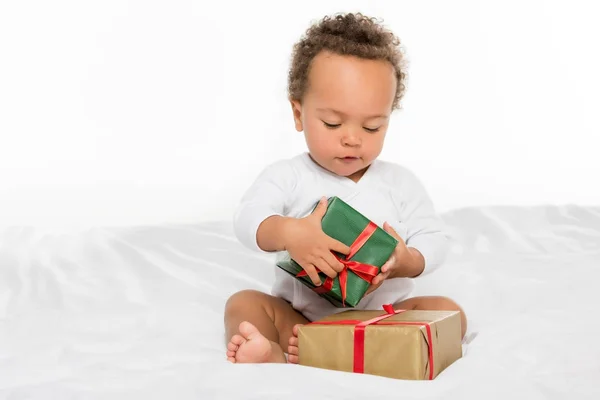 African american toddler with gifts — Stock Photo