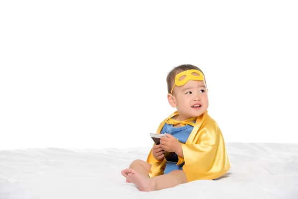 Asian toddler with smartphone — Stock Photo