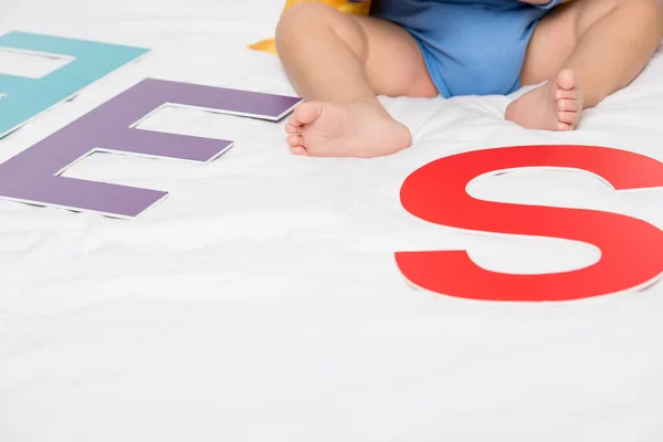 Baby and paper letters — Stock Photo