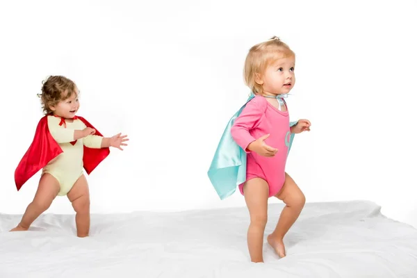 Toddler girls in superhero capes — Stock Photo