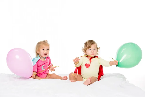 Cute toddlers with balloons — Stock Photo