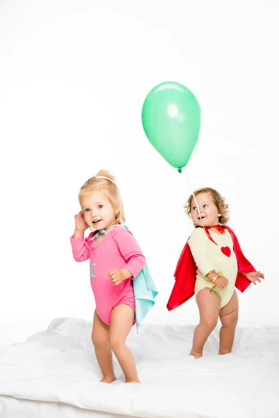 Toddlers in superhero capes — Stock Photo