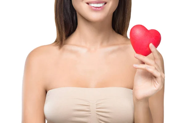 Girl holding heart symbol — Stock Photo