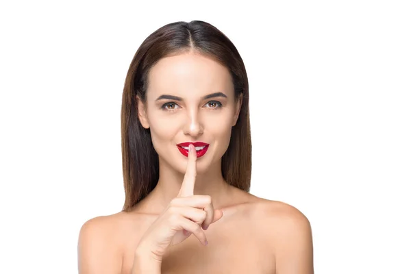 Girl with finger on lips — Stock Photo