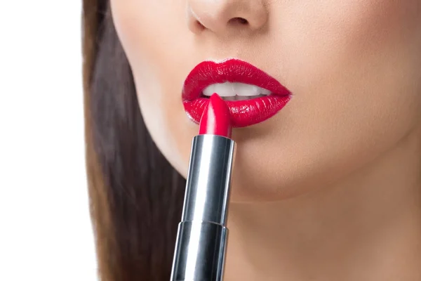 Young woman applying lipstick — Stock Photo