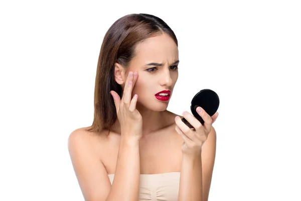 Girl looking at small mirror — Stock Photo