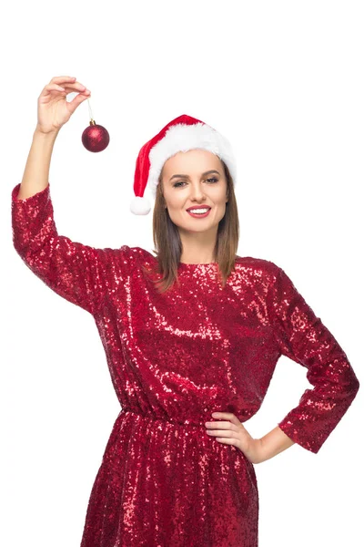 Chica en santa hat con bauble - foto de stock