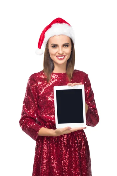 Дівчина в капелюсі Санта з цифровим планшетом — стокове фото
