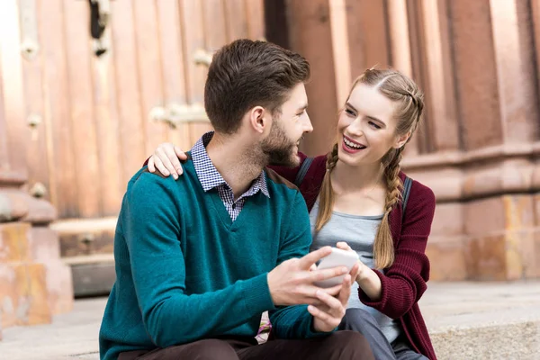 Happy pregnant woman hugging husband — Stock Photo