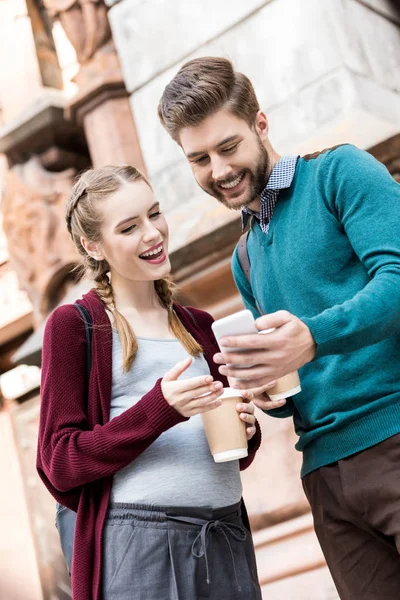 Couple using smartphone — Stock Photo