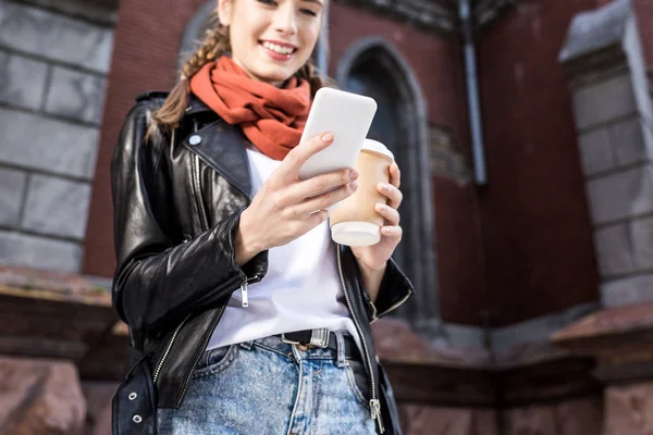 Woman with smartphone on street — Stock Photo