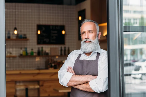 Senior coffee shop lavoratore — Foto stock