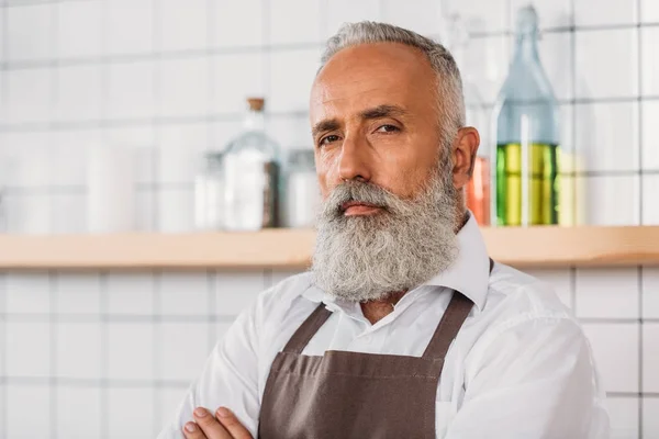 Senior coffee shop worker — Stock Photo