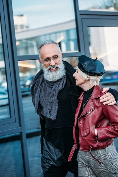 Stylish senior couple walking on street — Stock Photo