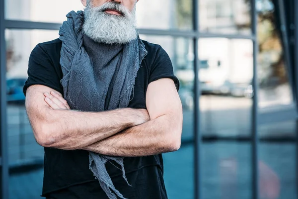 Senior man with arms crossed — Stock Photo