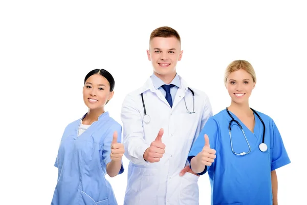Cirujanos y médicos con los pulgares arriba - foto de stock