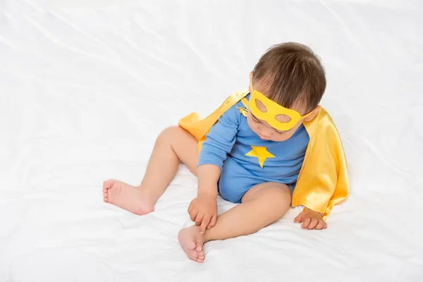 Asian toddler in superhero cape — Stock Photo