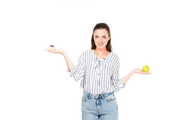 Frau mit Gebäck und Apfel — Stockfoto