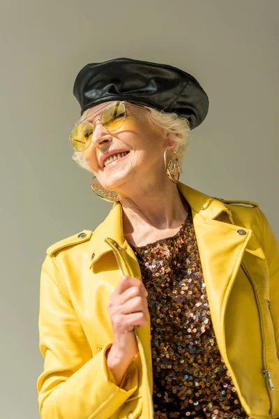 Senior lady in yellow jacket — Stock Photo