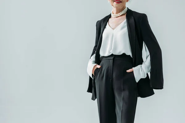 Senior lady in black suit — Stock Photo
