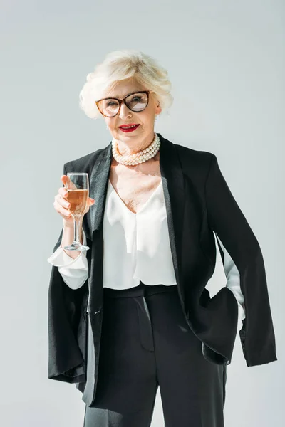 Senior lady with champagne — Stock Photo