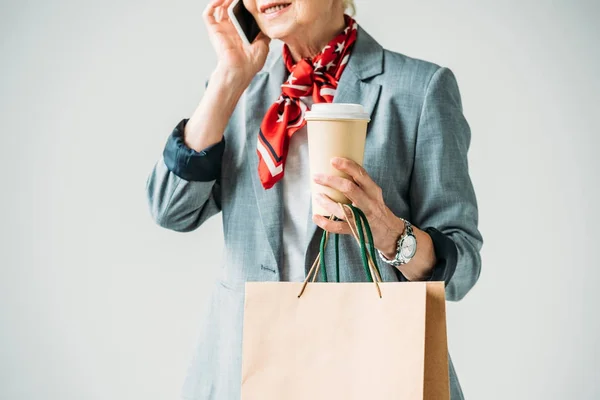 Lady with shopping bags and smartphone — стоковое фото