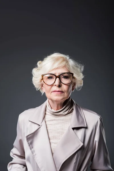 Senior lady in trench coat — Stock Photo