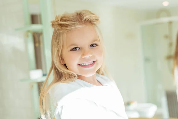 Adorable child in bathrobe — Stock Photo