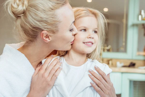Mother and daughter in bathrobes — Stock Photo