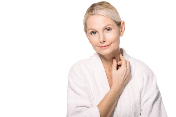 Mature woman touching neck — Stock Photo