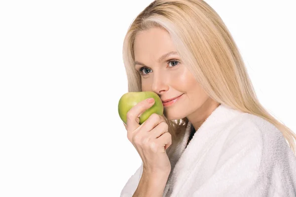 Mature woman with green apple — Stock Photo