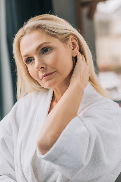 Mature woman in bath robe — Stock Photo