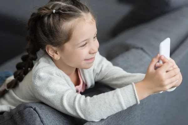 Girl using smartphone — Stock Photo