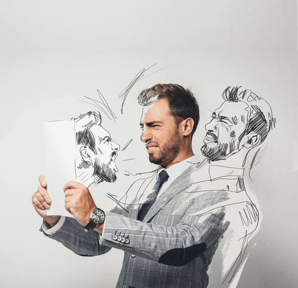 Businessman drawing himself with pencil — Stock Photo