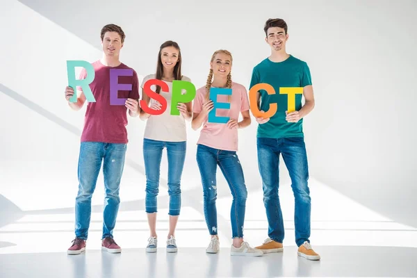 Friends holding word respect — Stock Photo