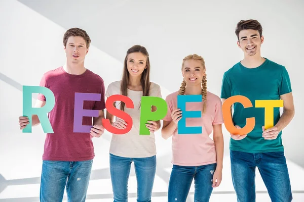 Friends holding word respect — Stock Photo