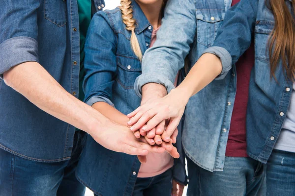 Friends stacking hands — Stock Photo