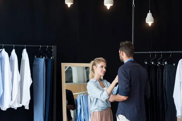 Couple choosing necktie in boutique — Stock Photo