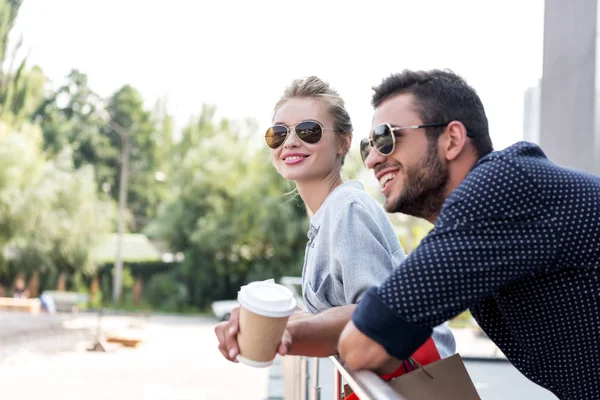 Young couple with coffee to go — Stock Photo