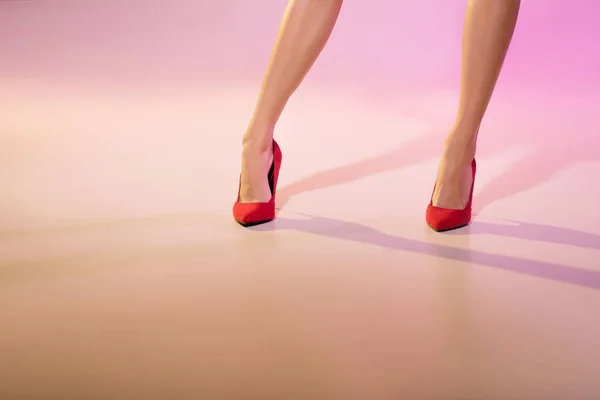 Legs in red heels — Stock Photo