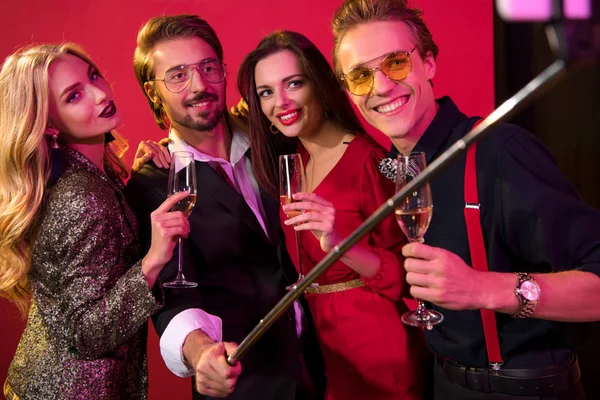 Couples taking selfie with champagne — Stock Photo