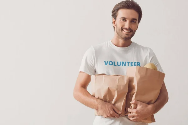 Volunteer with paper bags — Stock Photo