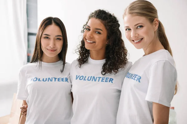 Multiethnic female volunteers — Stock Photo