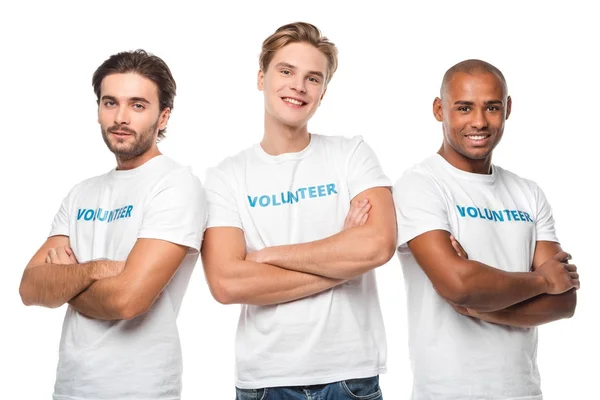 Voluntarios guapos con brazos cruzados - foto de stock