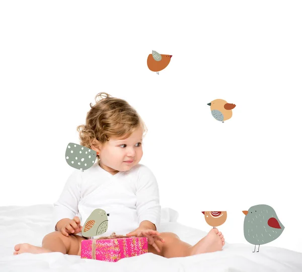 Toddler girl with wrapped present — Stock Photo
