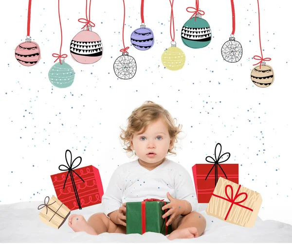 Toddler girl with wrapped present — Stock Photo